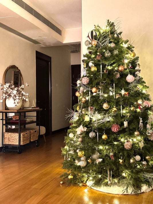 Christmas tree with warm lights and soft metallic decorations
